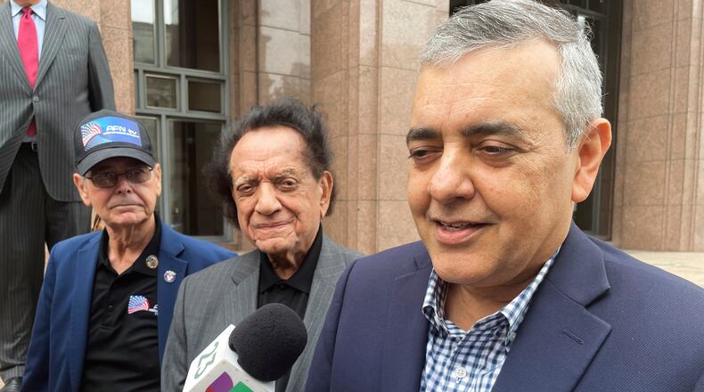 FILE - Former U.S. Rep. David Rivera speaks with media outside a federal court in Miami, Dec. 20, 2022. (AP Photo/Joshua Goodman, File)