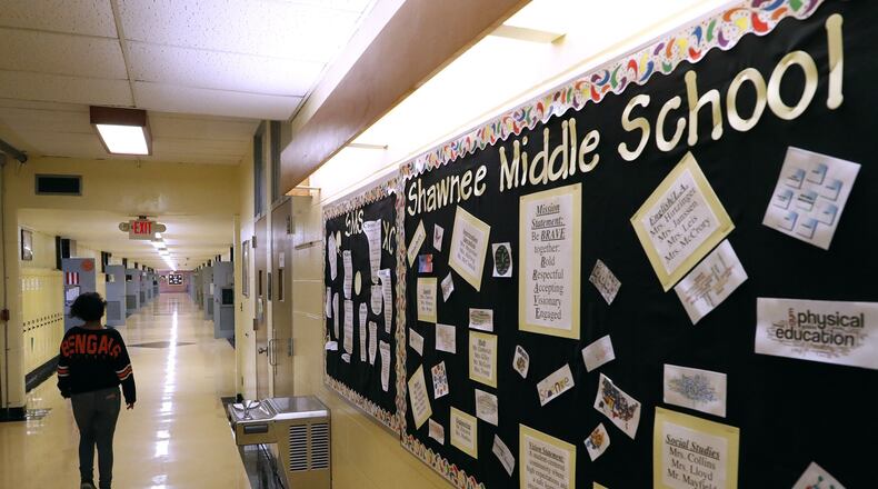 A middle school student walks down the hall in the middle school at Clark-Shawnee in this file photo. Bill Lackey/Staff