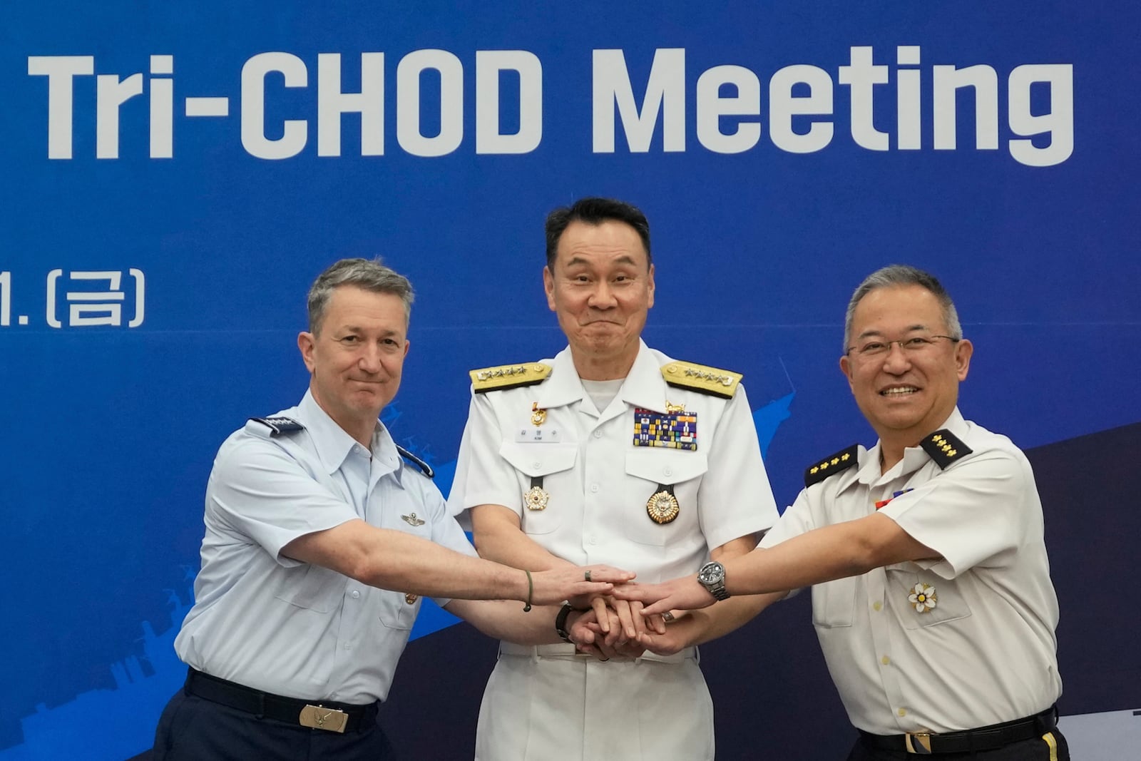 Gen, Yoshihide Yoshida, 1st right, Chief of Staff, Joint Staff of Japan, Adm. Kim Myung-soo, chairman of the South Korean Joint Chiefs of Staff, and John Daniel Caine, left, Chairman of the U.S. Joint Chiefs of Staff, pose during a Trilateral Chiefs of Defense meeting at the Defense Ministry in Seoul, South Korea, Friday, July 11, 2025. (AP Photo/Ahn Young-joon, Pool)
