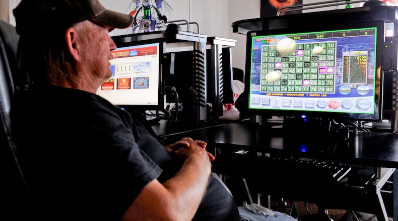 Larry Truman plays a game on an internet terminal at Erie Sweepstakes Thursday, Aug. 9, 2012 on South Erie Boulevard in Hamilton.