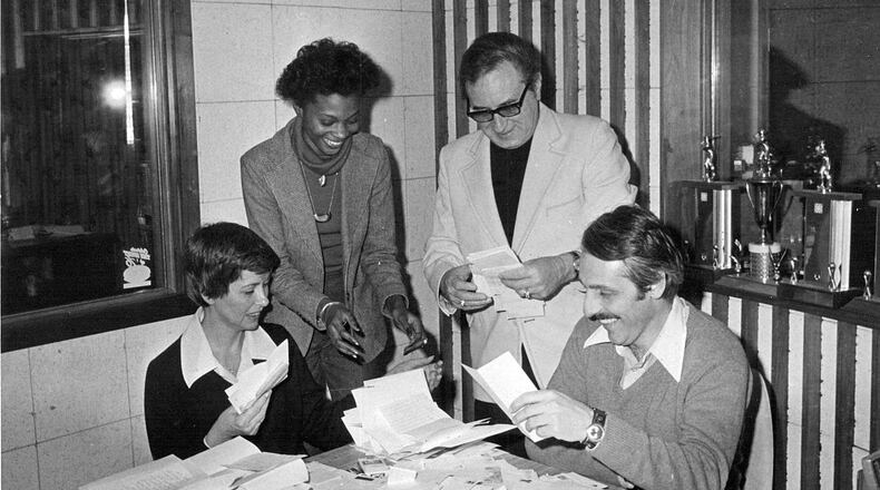 Shown here are (seated) June Powers, WBLY program director and Dan Cline, news director with receptionist Diane Wynn, and Robert Smilin’ Bob Yontz. PHOTO COURTESY OF THE CLARK COUNTY HISTORICAL SOCIETY