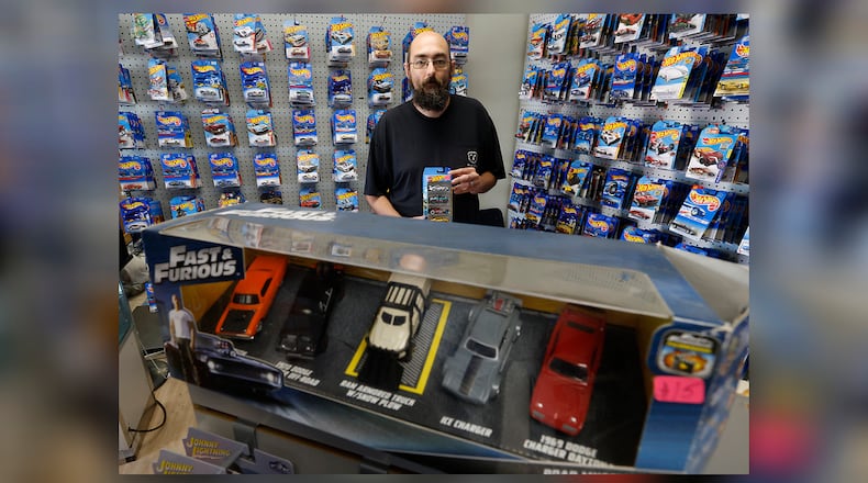 Robert Carter, the owner of Carters' Junk Drawer in New Carlisle, has a little bit of everything in his shop but most of the inventory centers around Hot Wheels cars. Carter's has been open for nearly three years but has recently moved around the corner to Washington Street. BILL LACKEY/STAFF