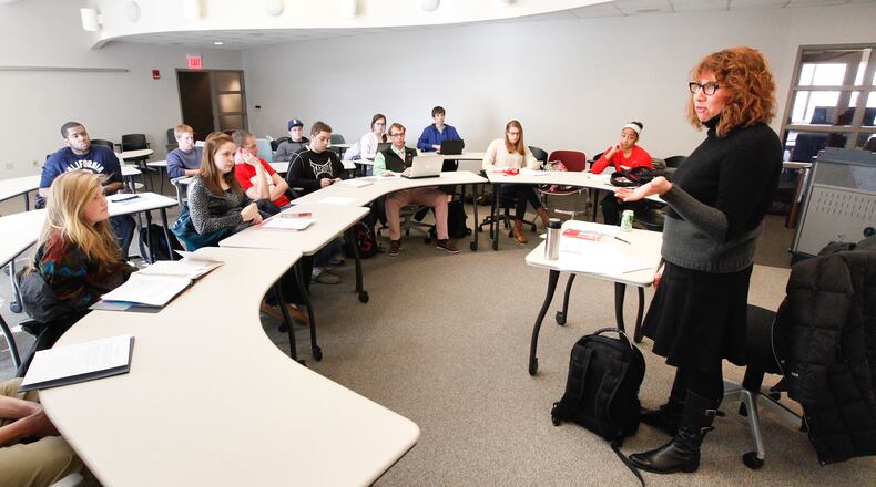 Susan Trollinger, associate professor of English and director of writing programs at the University of Dayton, leads a seminar of a required first-year interdisciplinary humanities course on Tuesday, January 22. Beginning for the class entering school this fall, first-year students will receive a personalized, two-page financial aid prospectus that will detail upfront all billable costs through graduation.