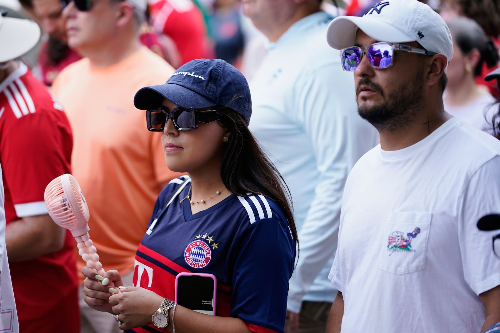 Camila Hernandez and her husband Camilo wait in line to enter Bank of America Stadium for a Club World Cup game, Tuesday, June 24, 2025, in Charlotte, N.C. (AP Photo/Erik Verduzco)