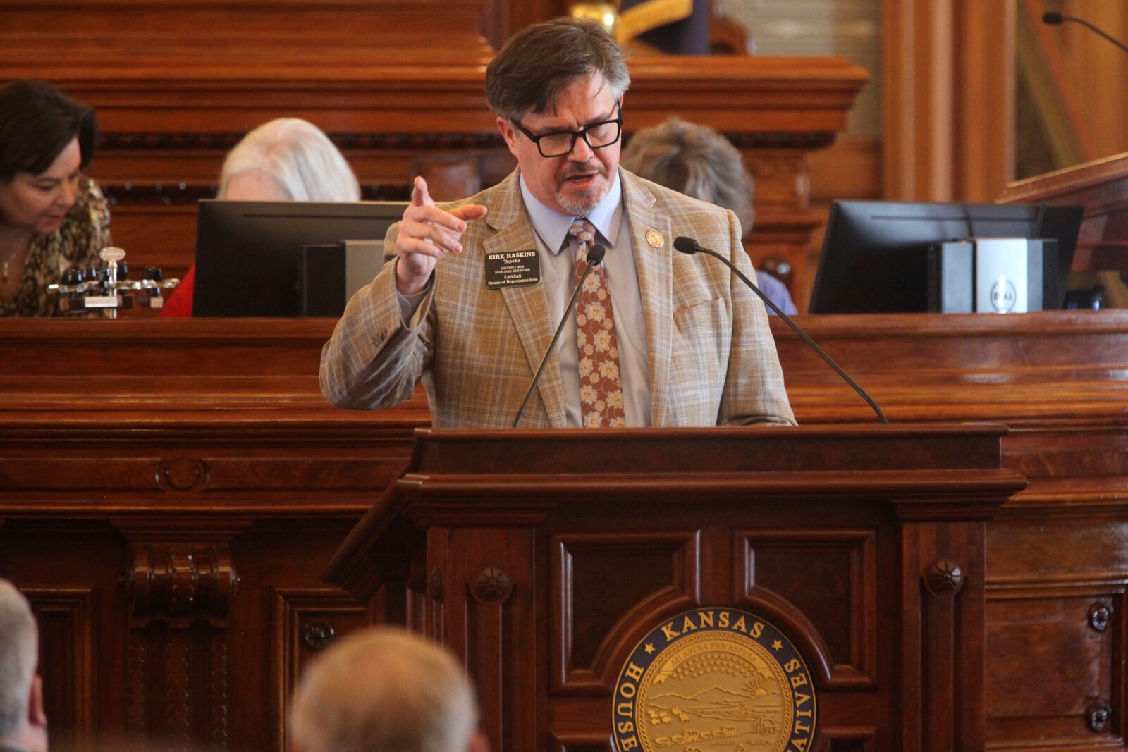 Kansas state Rep. Kirk Haskins, D-Topeka, criticizes a bill that would eliminate the extra three days that voters have after Election Day to return their mail ballots, Tuesday, March 25, 2025, at the Statehouse in Topeka, Kan. (AP Photo/John Hanna)