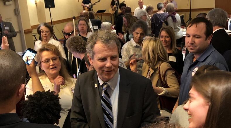U.S. Sen. Sherrod Brown met with dozens of people to shake hands and take pictures following his keynote speech at the Clark County Democratic Party’s Annual Freedom Dinner at Courtyard by Marriott on Thursday. Photo by Brett Turner