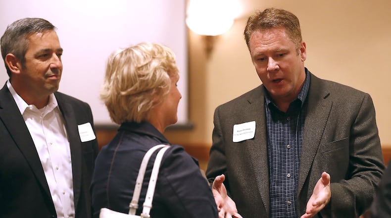 Congressman Warren Davidson talks with people after he spoke at the Chamber of Greater Springfield’s Legislative Luncheon Thursday at The Courtyard by Marriott in Springfield. Bill Lackey/Staff