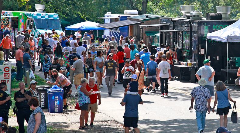 A crowd of hungry people filled Veterans Park Saturday, August 17, 2024 for the 10th annual Springfield Rotary Gourmet Food Truck Competition. BILL LACKEY/STAFF