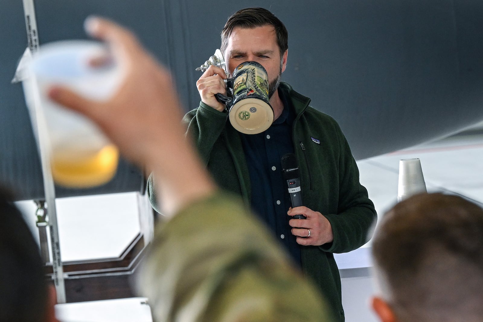 U.S. Vice President JD Vance gives a toast to U.S. service members during a refueling stop at Ramstein Air Base, Germany while en route to Joint Base Andrews, Md., Thursday April 24, 2025. (Kenny Holston/Pool Photo via AP)