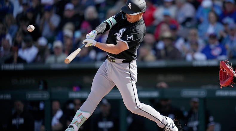 Chicago White Sox's Munetaka Murakami, of Japan, connects for a two-run double against the Chicago Cubs during the fourth inning of a spring training baseball game Friday, Feb. 20, 2026, in Mesa, Ariz. (AP Photo/Ross D. Franklin)