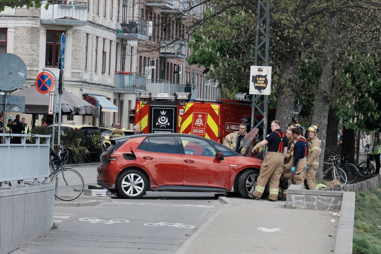 Police and rescue workers on Sortedam Dossering where a car has run into a crowd, Copenhagen, Wednesday, April 30, 2025. (Thomas Traasdahl/Scanpix via AP)