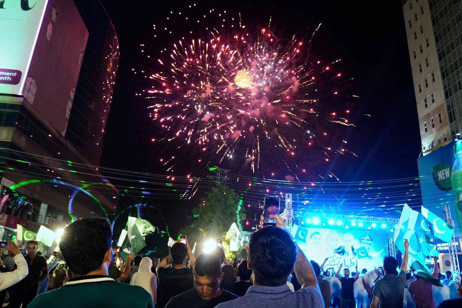 People watch fireworks during an event to show solidarity with the Pakistan Army, a day after the ceasefire between Indian and Pakistan was announced, in Lahore, Pakistan, Sunday, May 11, 2025. (AP Photo/K.M. Chaudary)