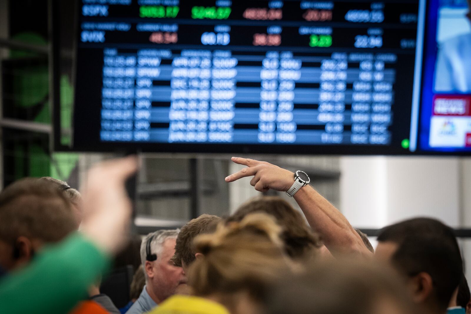 Traders work in the S&P options pit at the Cboe Options Exchange in the Chicago Board of Trade Building in the Loop, Monday, April 7, 2025. (Ashlee Rezin/Chicago Sun-Times via AP)