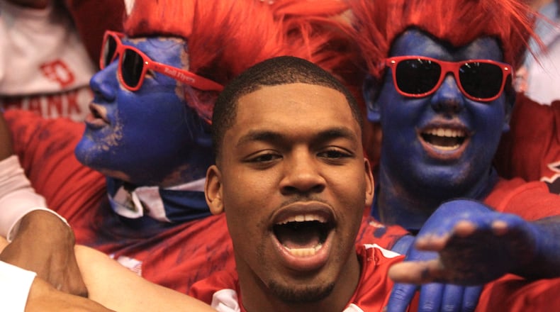 Dayton's Trey Landers celebrates in the student section after a victory against Virginia Commonwealth on March 1, 2017, at UD Arena.