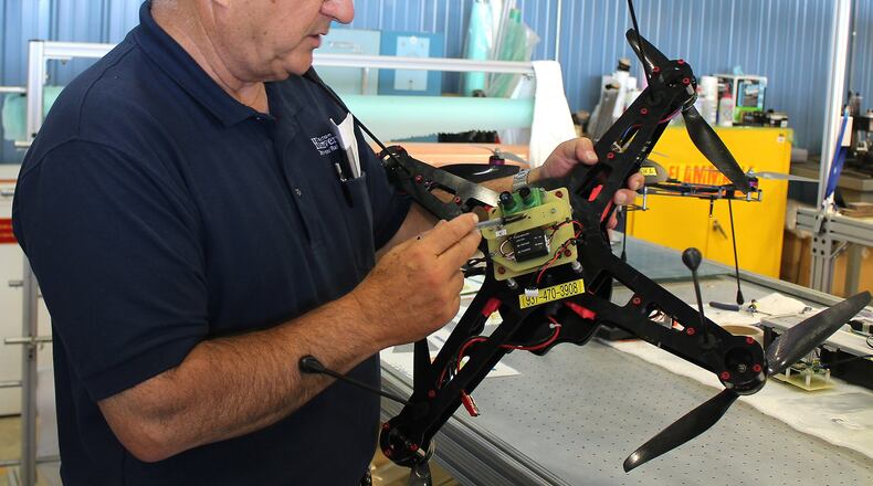 Frank Beafore, owner of SelectTech, works on a UAV Friday. Clark State adds to its ag precision program. Jeff Guerini/Staff
