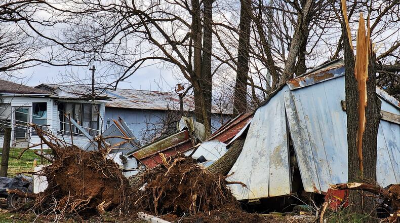 The tops of trees were snapped off and power lines damaged Monday afternoon, Feb. 27, 2023, along West Alexandria Road in Madison Twp., Butler County after a funnel cloud was spotted during a tornado warning issued by the National Weather Service in Wilmington. NICK GRAHAM/STAFF