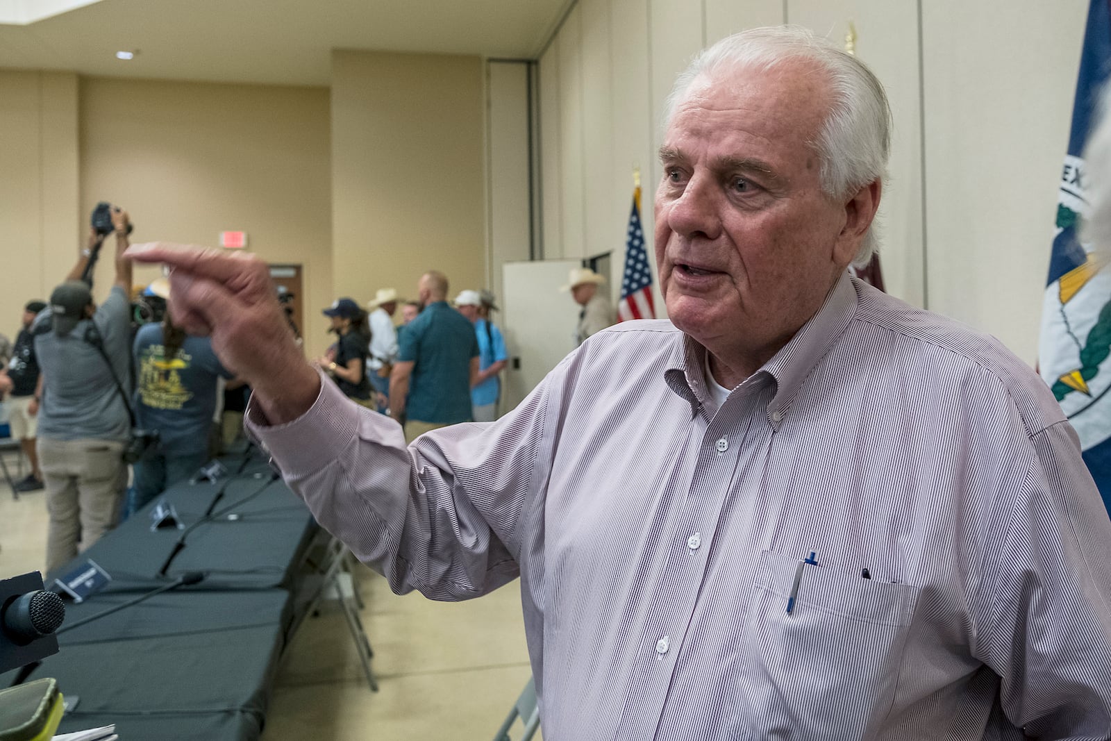 Kerr County Judge Rob Kelly speaks to members of the media following a press conference held by Gov. Greg Abbott discussing the ongoing search and rescue efforts after recent flooding along the Guadalupe River on Saturday, July 5, 2025, in Kerrville, Texas. (AP Photo/Rodolfo Gonzalez)