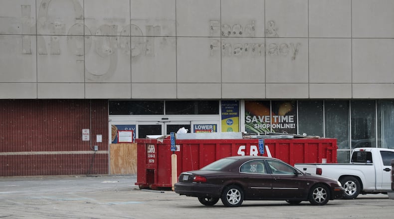 Work has begun to turn the old Kroger grocery store on North Limestone Street into a medical facility for Kettering Health Network. BILL LACKEY/STAFF