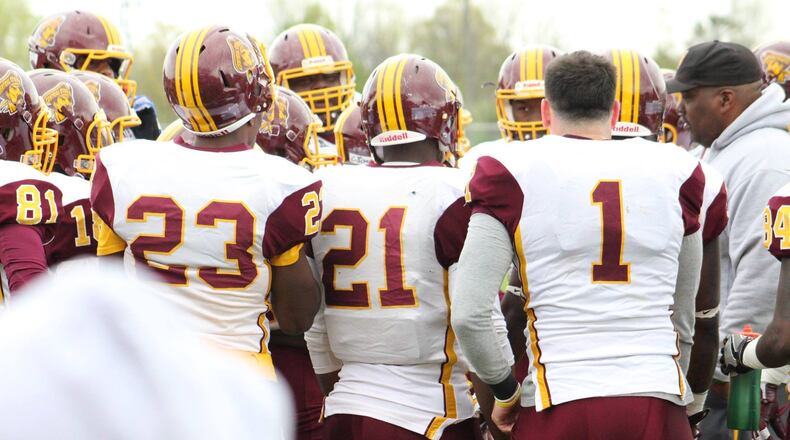 Trent Mays (1) huddles around the Central State offense during the spring game April 22. CSU head coach Cedric Pearl is at right. Photo courtesy of Central State University