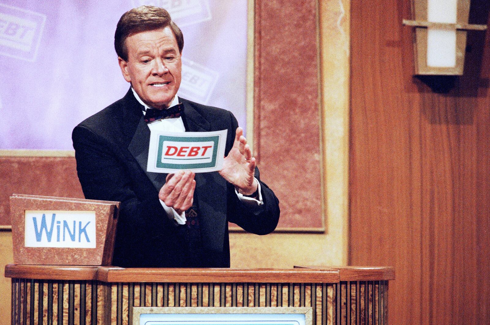 FILE - Host Wink Martindale looks at a card during game show, May 22, 1997. (AP Photo/Nick Ut, File)