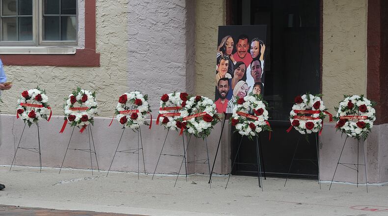 A painting of the nine victims of the Oregon District shooting, is on display in the Oregon District, Thursday Aug. 4, 2022. MARSHALL GORBY\STAFF