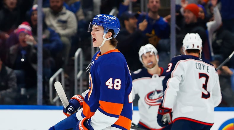 New York Islanders defenseman Matthew Schaefer (48) reacts after scoring against the Columbus Blue Jackets during the first period of an NHL hockey game, Sunday, Nov. 2, 2025, in New York. (AP Photo/Noah K. Murray)
