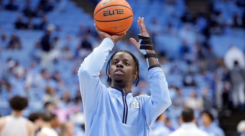 North Carolina forward Caleb Wilson, with his left arm in a medical brace and not playing in the game, shoots during warm-ups before an NCAA college basketball game against Pittsburgh, Saturday, Feb. 14, 2026, in Chapel Hill, N.C. (AP Photo/Chris Seward)