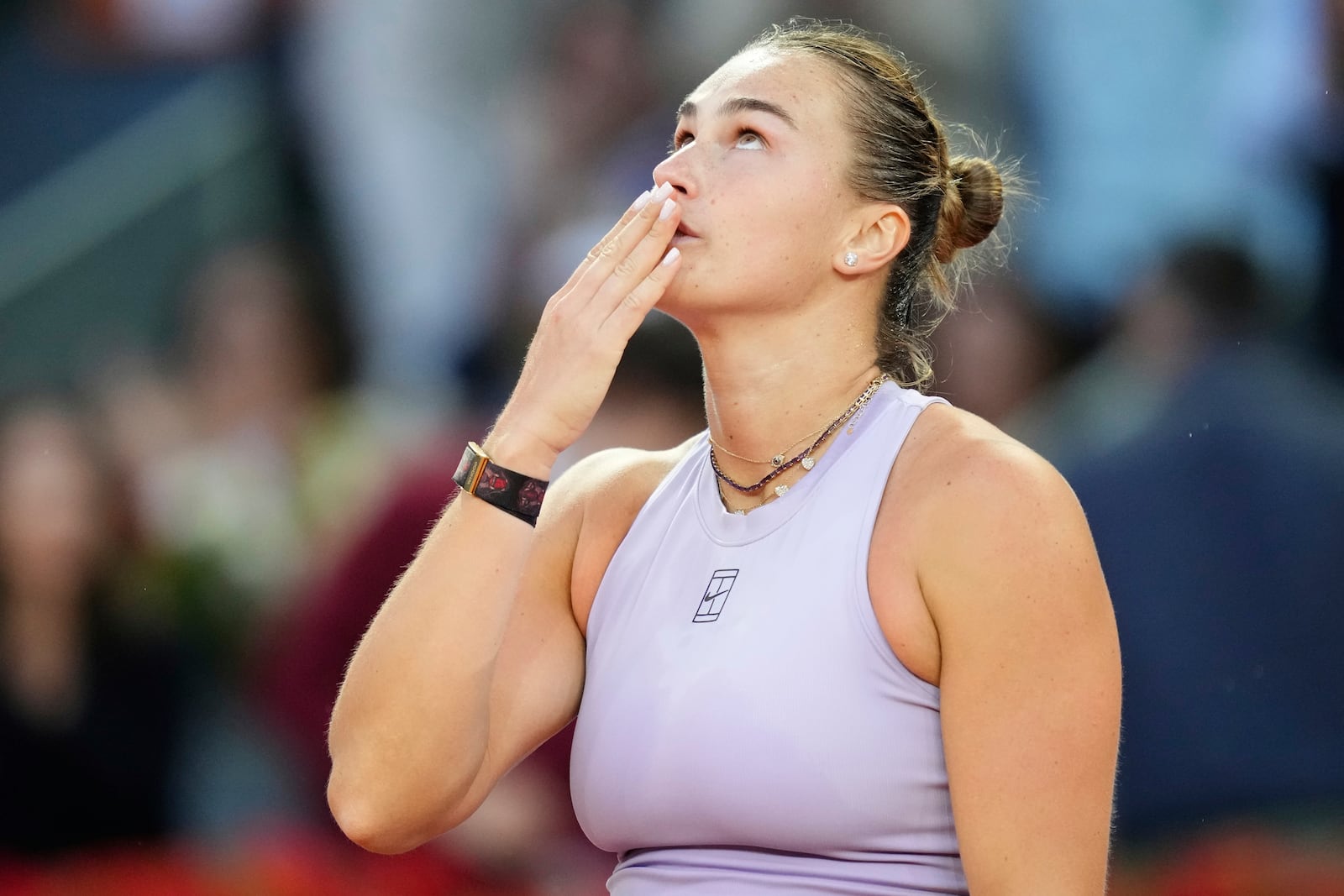 Aryna Sabalenka of Belarus reacts after winning the Madrid Open tennis final against United States' Coco Gauff in Madrid, Spain, Saturday, May 3, 2025. (AP Photo/Jose Breton)