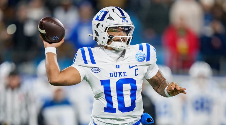 FILE - Duke quarterback Darian Mensah looks to pass the ball against Virginia in the first half of the Atlantic Coast Conference championship NCAA college football game in Charlotte, N.C., Dec. 6, 2025. (AP Photo/Jacob Kupferman)