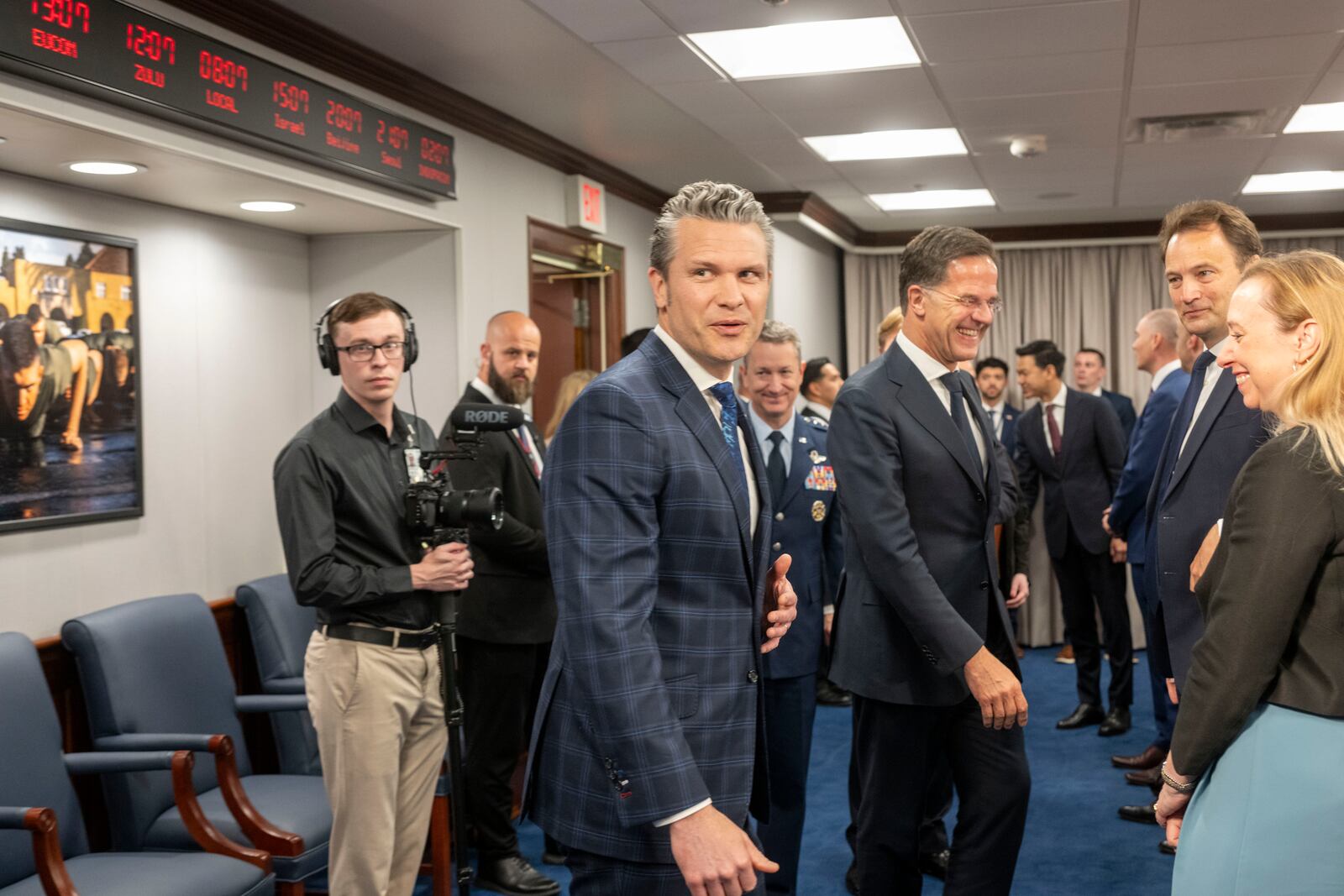 Defense Secretary Pete Hegseth, center, walks to his seat at the start of a meeting with NATO Secretary General Mark Rutte, center right, at the Pentagon, Thursday, April 24, 2025 in Washington. (AP Photo/Kevin Wolf)