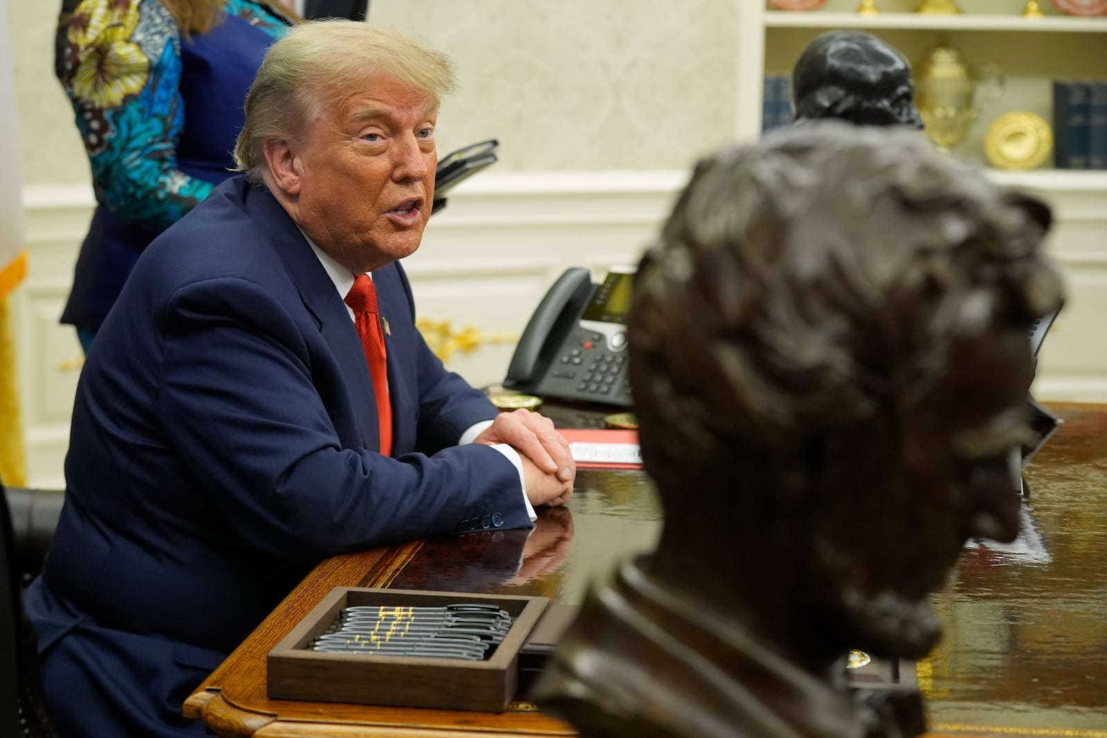 President Donald Trump answers questions from reporters as he meets with Congo's Foreign Minister Therese Kayikwamba Wagner, and Rwanda's Foreign Minister Olivier Nduhungirehe, Friday, June 27, 2025, in the Oval Office at the White House in Washington. (AP Photo/Manuel Balce Ceneta)