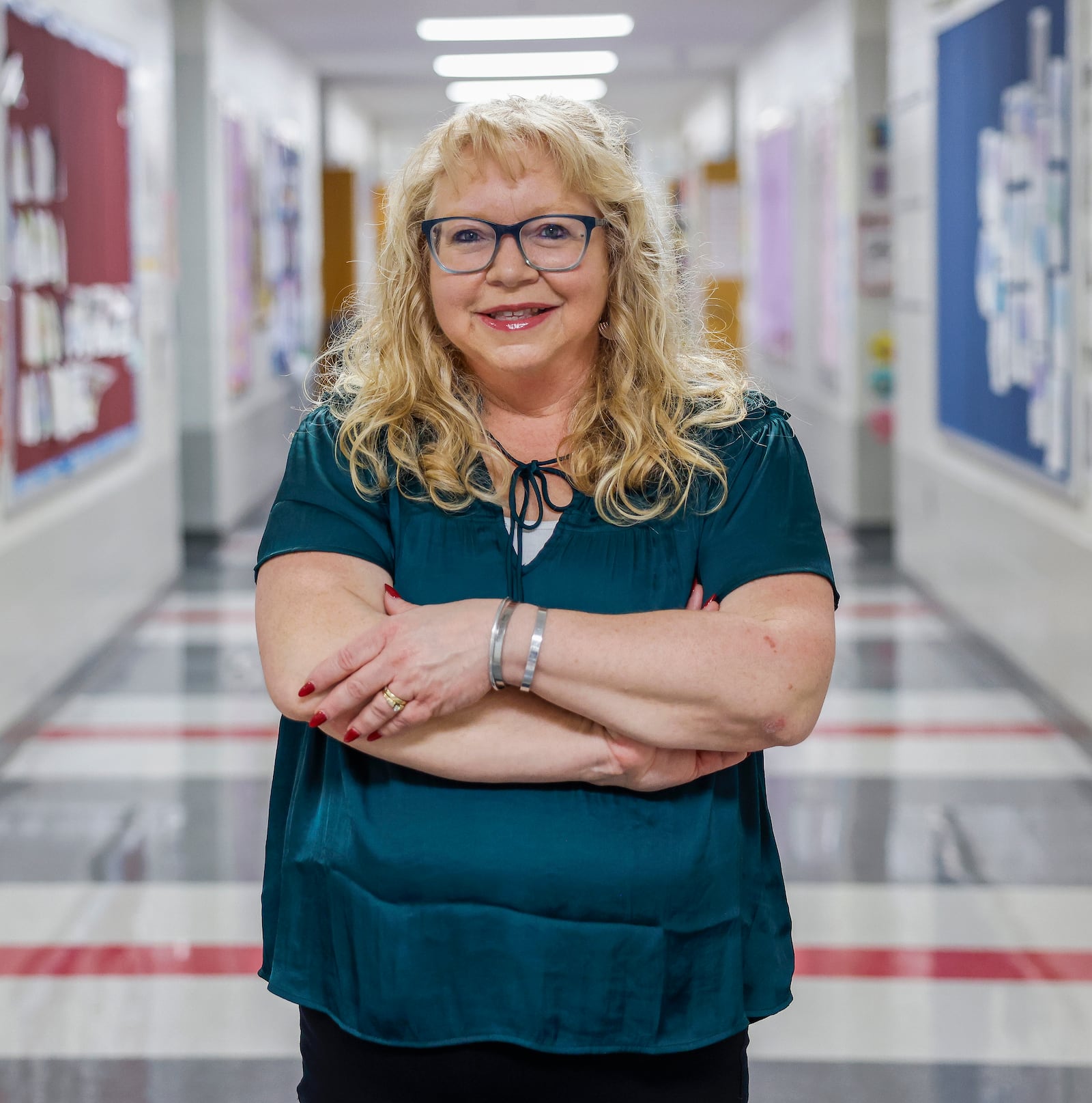 Second grade teacher Beckitt Bostick in a hallway outside her classroom at Perrin Woods Elementary on Wednesday, March 11, 2026, in Springfield. She's one of four teachers who will receive an Excellence in Teaching Award on March 23. JOSEPH COOKE/STAFF