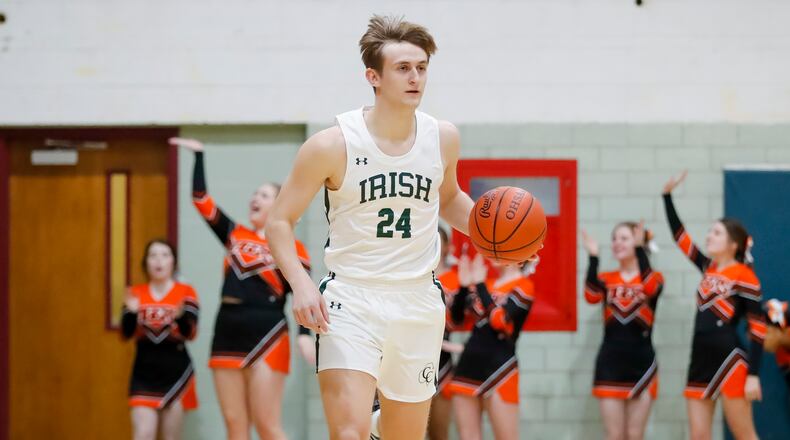 Catholic Central High School senior Tyler Galluch dribbles the ball up the floor during their game against West Liberty-Salem earlier this month. Galluch is averaging 20.2 points and 9.9 rebounds per game. Michael Cooper/CONTRIBUTED