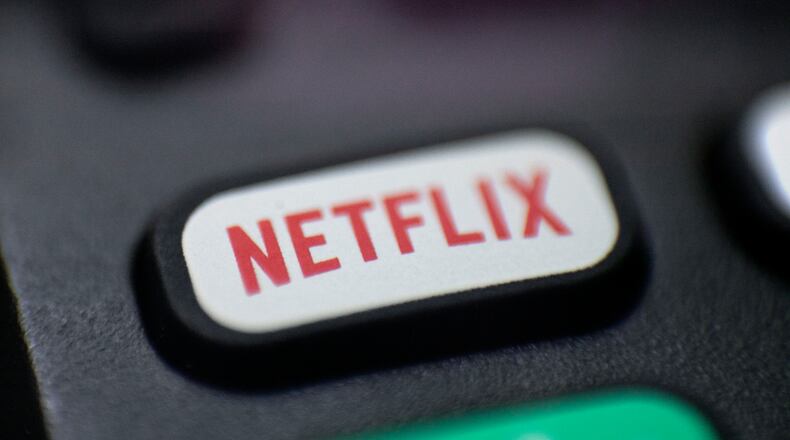 FILE - The Netflix logo is pictured on a remote control in Portland, Ore., Aug. 13, 2020. Netflix said Wednesday, Dec. 21, 2022, that it plans to build a state-of-the-art production facility at a former Army base at the Jersey Shore that will cost more than $900 million, and create thousands of jobs. (AP Photo/Jenny Kane, File)