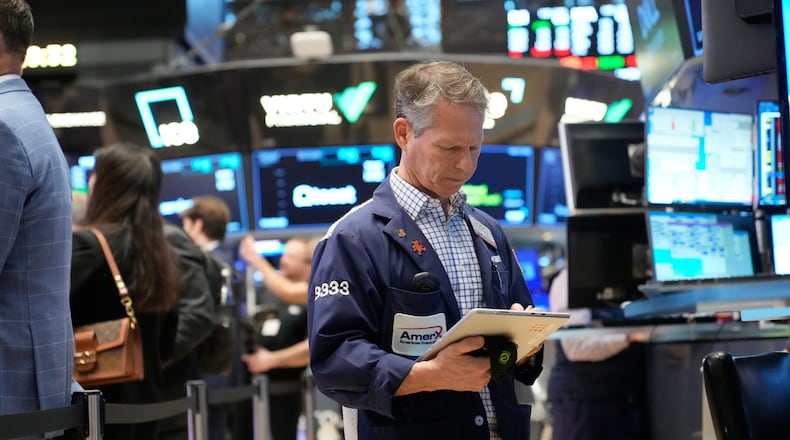 Bobby Charmak works on the floor at the New York Stock Exchange in New York, Friday, March 6, 2026. (AP Photo/Seth Wenig)