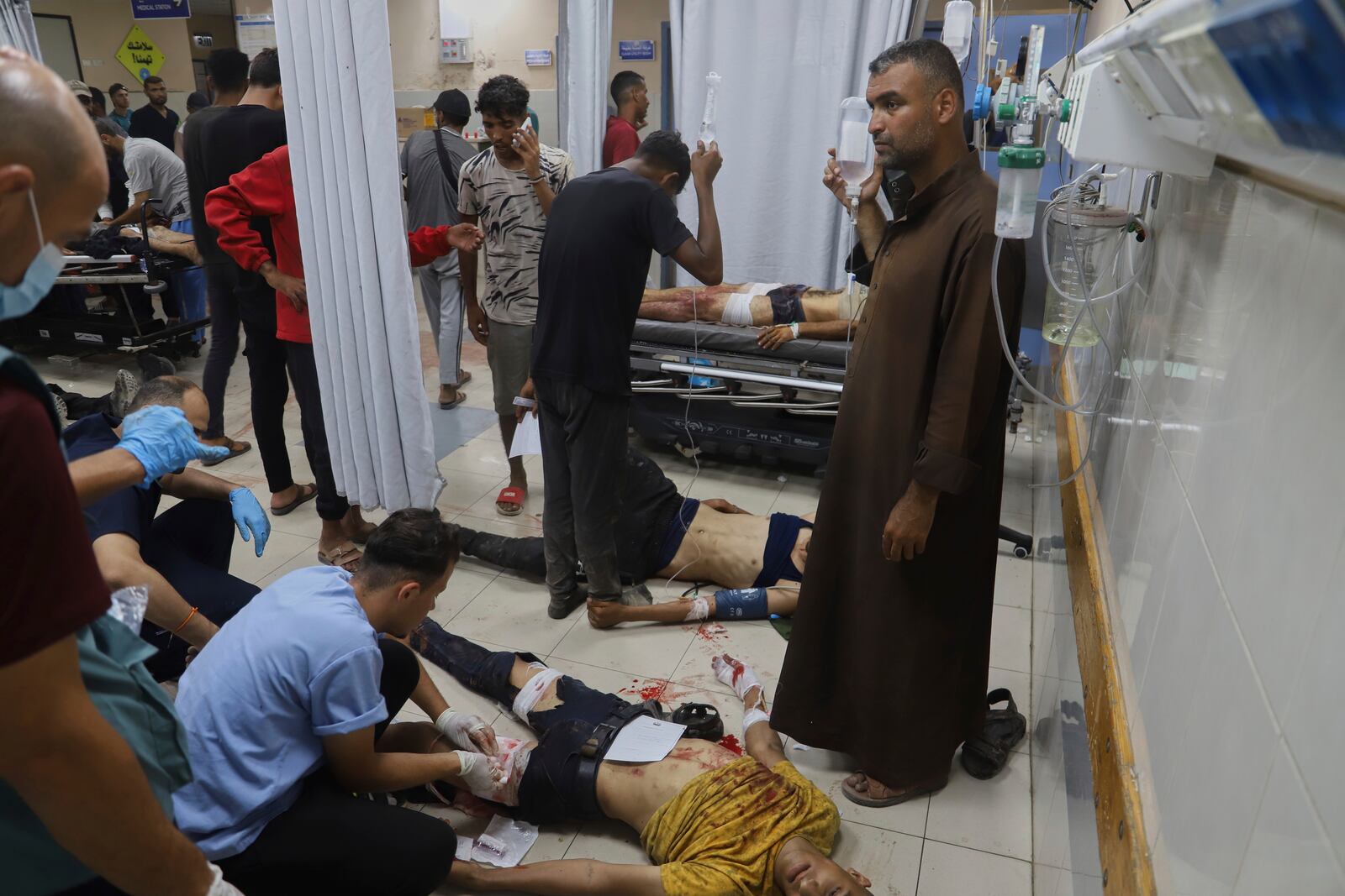 Palestinians wounded while returning from one of the Gaza Humanitarian Foundation distribution centers operated by the U.S.-backed organization, according to Nasser Hospital, are treated in Khan Younis, Monday, June 30, 2025. (AP Photo/Mariam Dagga)