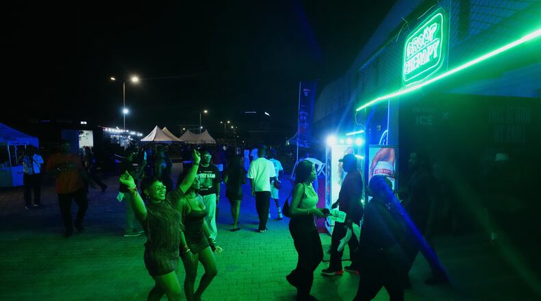 People arrive for a Group Therapy rave in Lekki, an upscale part of Lagos, Nigeria, early Saturday, Feb. 28, 2026. (AP Photo/Sunday Alamba)