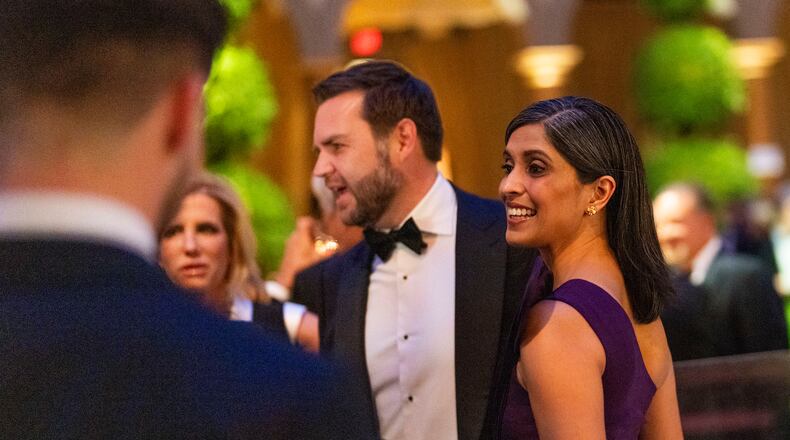Vice President-elect JD Vance and his wife Usha Vance speak to attendees while they wait for President-elect Donald Trump’s arrival during a candlelight dinner at the National Building Museum in Washington on Sunday, Jan. 19, 2025, the day before Trump’s inauguration. (Doug Mills/The New York Times)