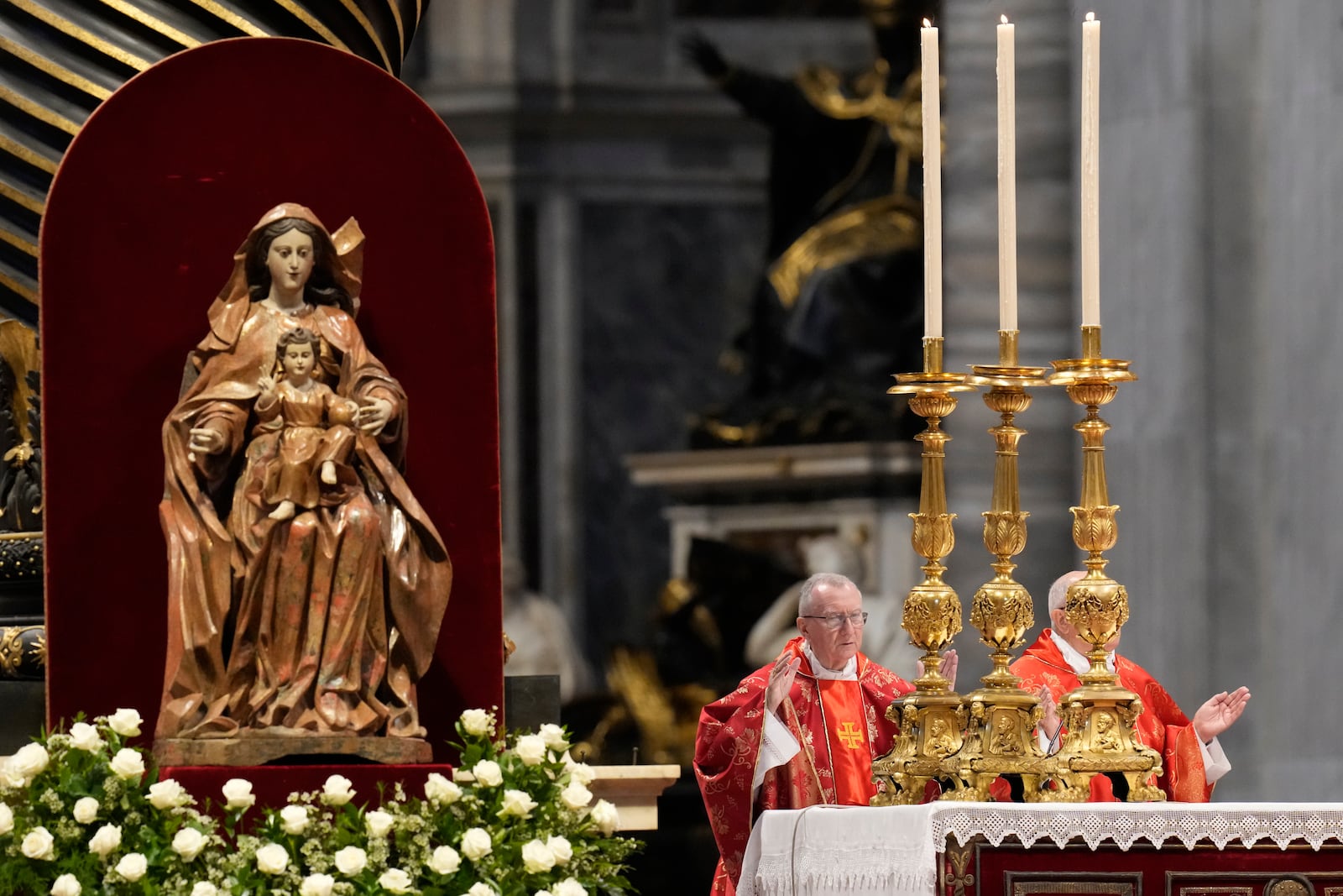 Cardinal Pietro Parolin, left, celebrates a final Mass celebrated by cardinals inside St. Peter's Basilica, before the conclave to elect a new pope, at the Vatican, Wednesday, May 7, 2025. (AP Photo/Gregorio Borgia)