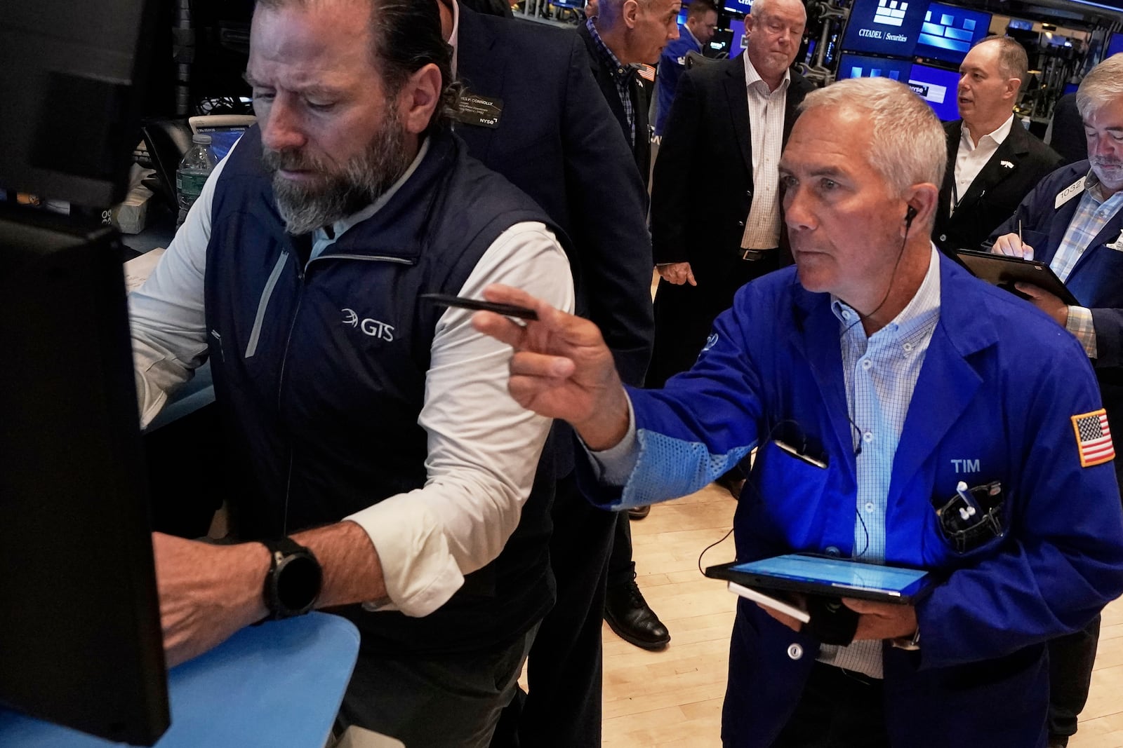 Specialist Michael Pistillo, right, and trader Timothy Nick work on the floor of the New York Stock Exchange, Thursday, May 1, 2025. (AP Photo/Richard Drew)