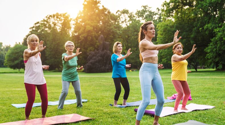 Yoga in park. DIAMOND DOGS/ISTOCK