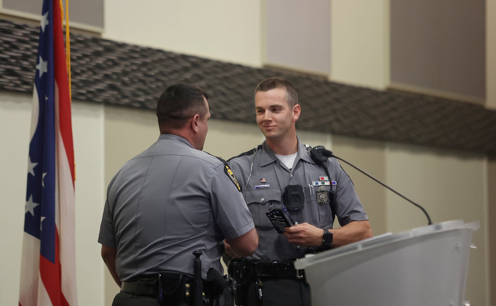 Ohio State Highway Patrol Trooper Coleton Piatt, right, gets greeted by OSHP Springfield Post Lieutenant Shawn Cook as he's recognized at the Springfield Rotary Club's Service Above Self Awards on Monday, May 19, 2025, at Hollenbeck Bayley Center. JOSEPH COOKE/STAFF
