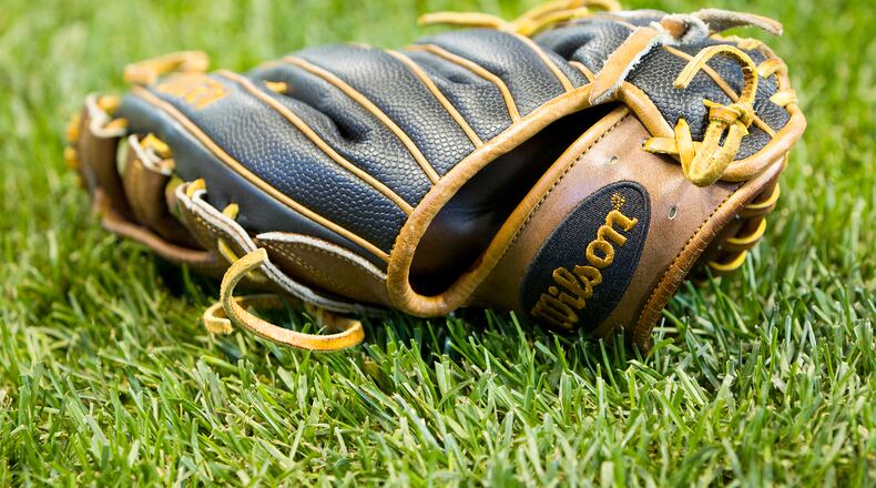 MILWAUKEE, WI - APRIL 22:  A baseball glove sits on the field before the game between the Philadelphia Phillies and Milwaukee Brewers at Miller Park on April 22, 2016 in Milwaukee, Wisconsin. (Photo by Dylan Buell/Getty Images)