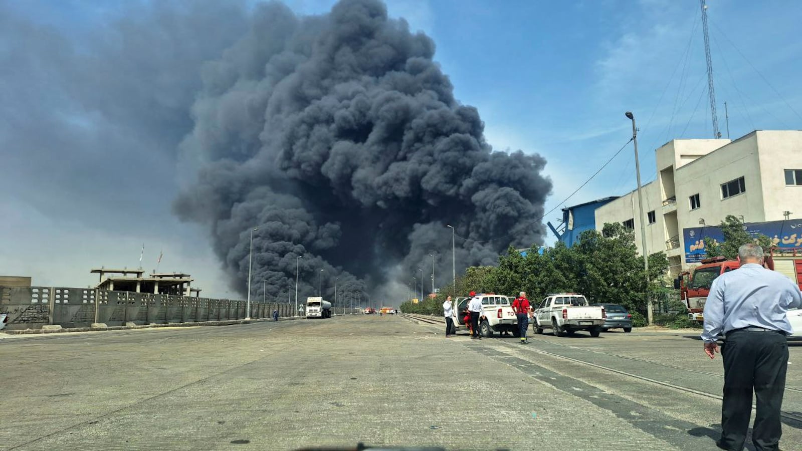 In this photo provided by Tasnim News Agency black smoke rises in the sky after a massive explosion rocked a port near the southern port city of Bandar Abbas, Iran, Saturday, April 26, 2025. (Meysam Mirzadeh/Tasnim News Agency via AP)