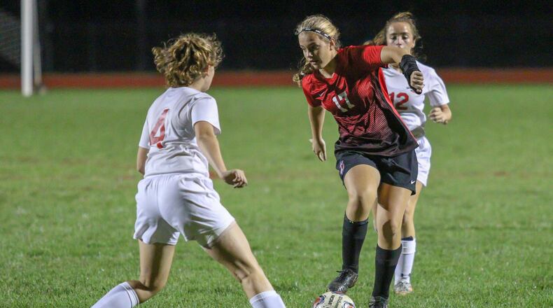 Tecumseh High School sophomore Bridget Harris dribbles the ball through the defense during the Arrows 3-1 victory over the Lakers on Wednesday, Oct. 10 at Spitzer Stadium in New Carlisle. Michael Cooper/CONTRIBUTED