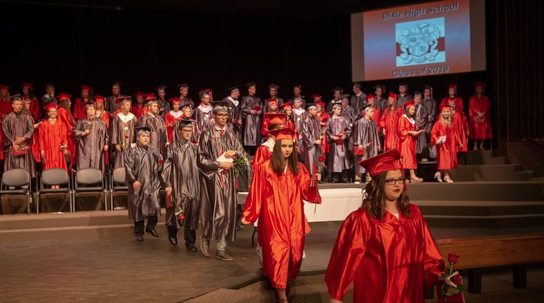 Hallee Barnett and Sarah Beach lead the Dixie High School graduation Class of 2018 from the Salem Church of God at the conclusion of the commencement ceremony.