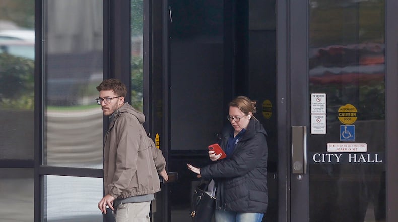 Employees leave work on Thursday, October 30, 2025, at Springfield City Hall. JOSEPH COOKE / STAFF