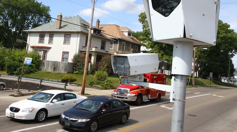 A red light camera supervises the intersection at North Limestone Street and McCreight Avenue in Springfield. Collection of fines from people caught running red lights by Springfield’s traffic cameras has been steadily declining, a Springfield News-Sun investigation found, as state lawmakers debate banning the cameras entirely. More than 40 percent of the tickets issued in the first four months of this year have gone unpaid. Barbara J. Perenic/Staff