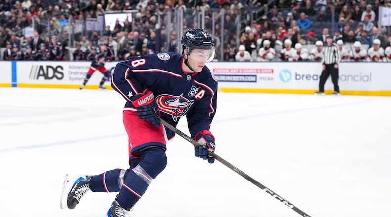 Columbus Blue Jackets defenseman Zach Werenski (8) controls the puck during the second period of an NHL hockey game against the Ottawa Senators Tuesday, Jan. 20, 2026, in Columbus, Ohio. (AP Photo/Jeff Dean)