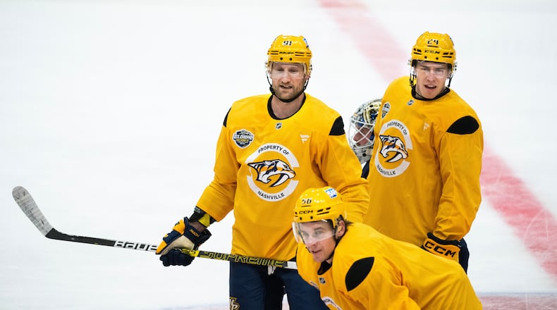 Nashville Predators Steven Stamkos, top left, Spencer Stastney and Erik Haula during a training in Stockholm, Sweden, Wednesday, Nov. 12, 2025, two days ahead of their NHL hockey match against Pittsburg Penguins. (Claudio Bresciani/TT News Agency via AP)